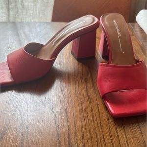 Intentionally blank red block heel mule sandals
